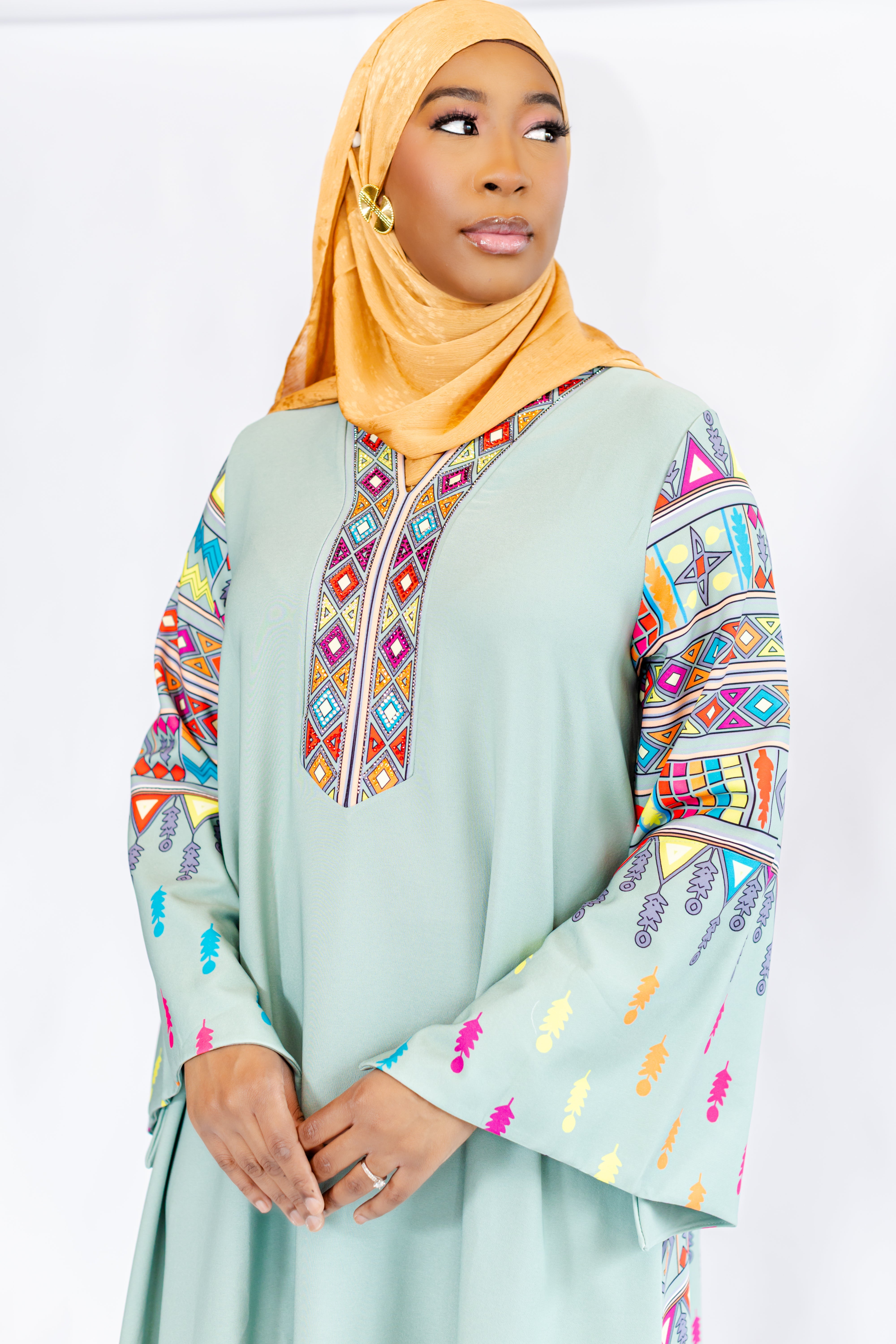 Elegant model showcasing an embellished abaya from The Abaya Edit collection, embodying luxury and modest style.