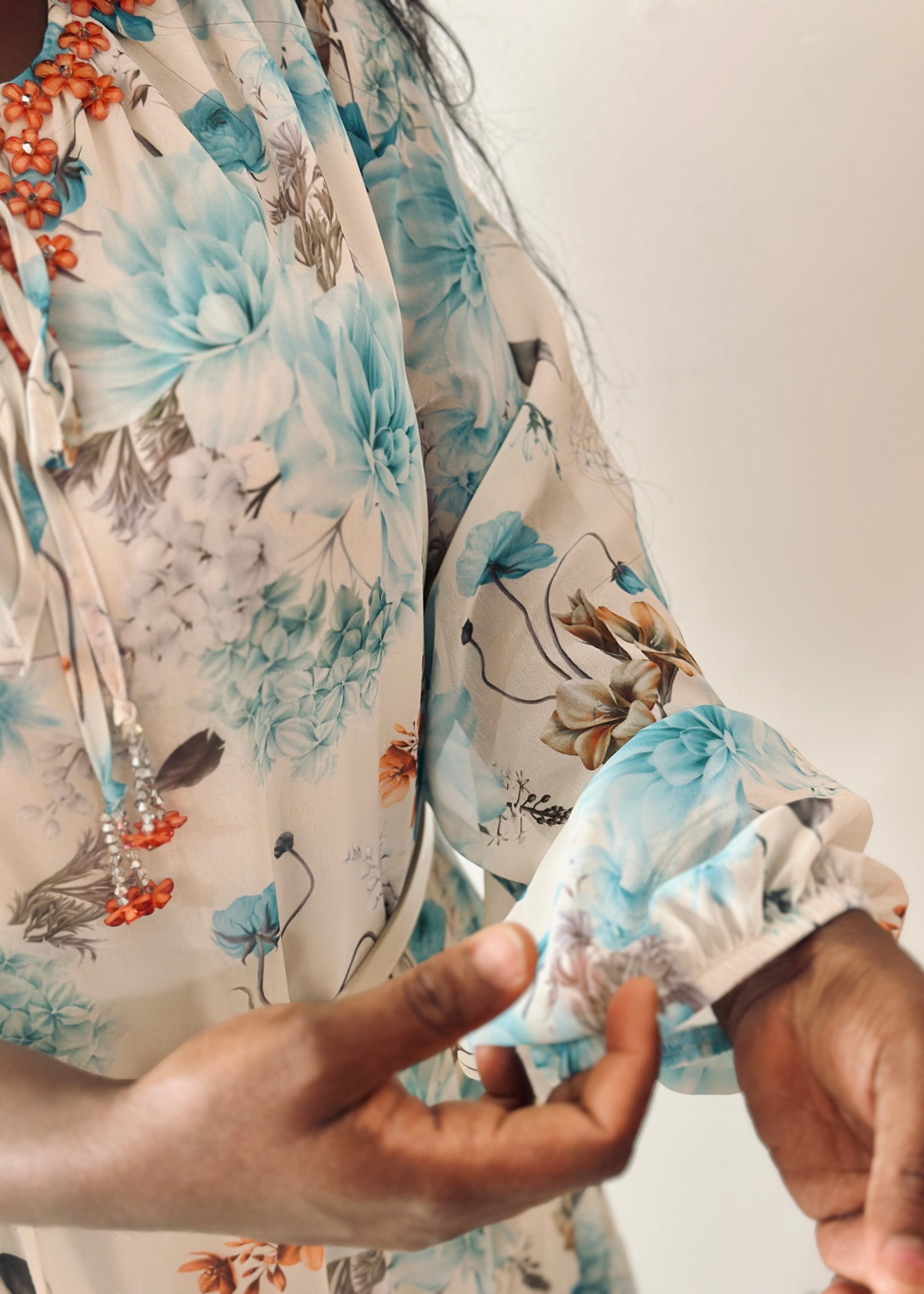 Grace Floral Maxi Dress featuring elegant aqua blue floral print and flowy sleeves, perfect for everyday wear.