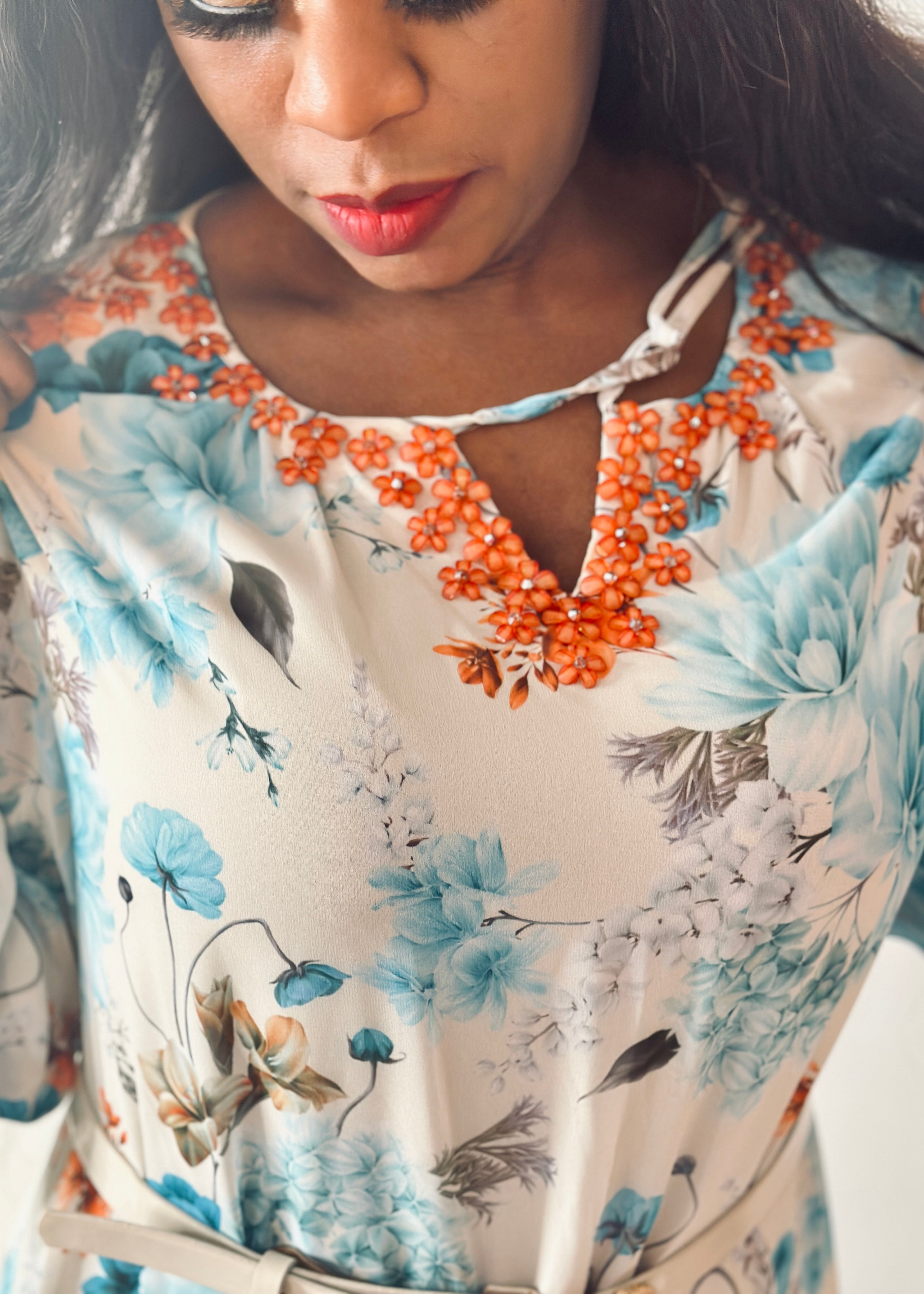 Grace Floral Maxi Dress featuring a soft floral print in aqua blue, coral, and cream tones, elegant for everyday wear.