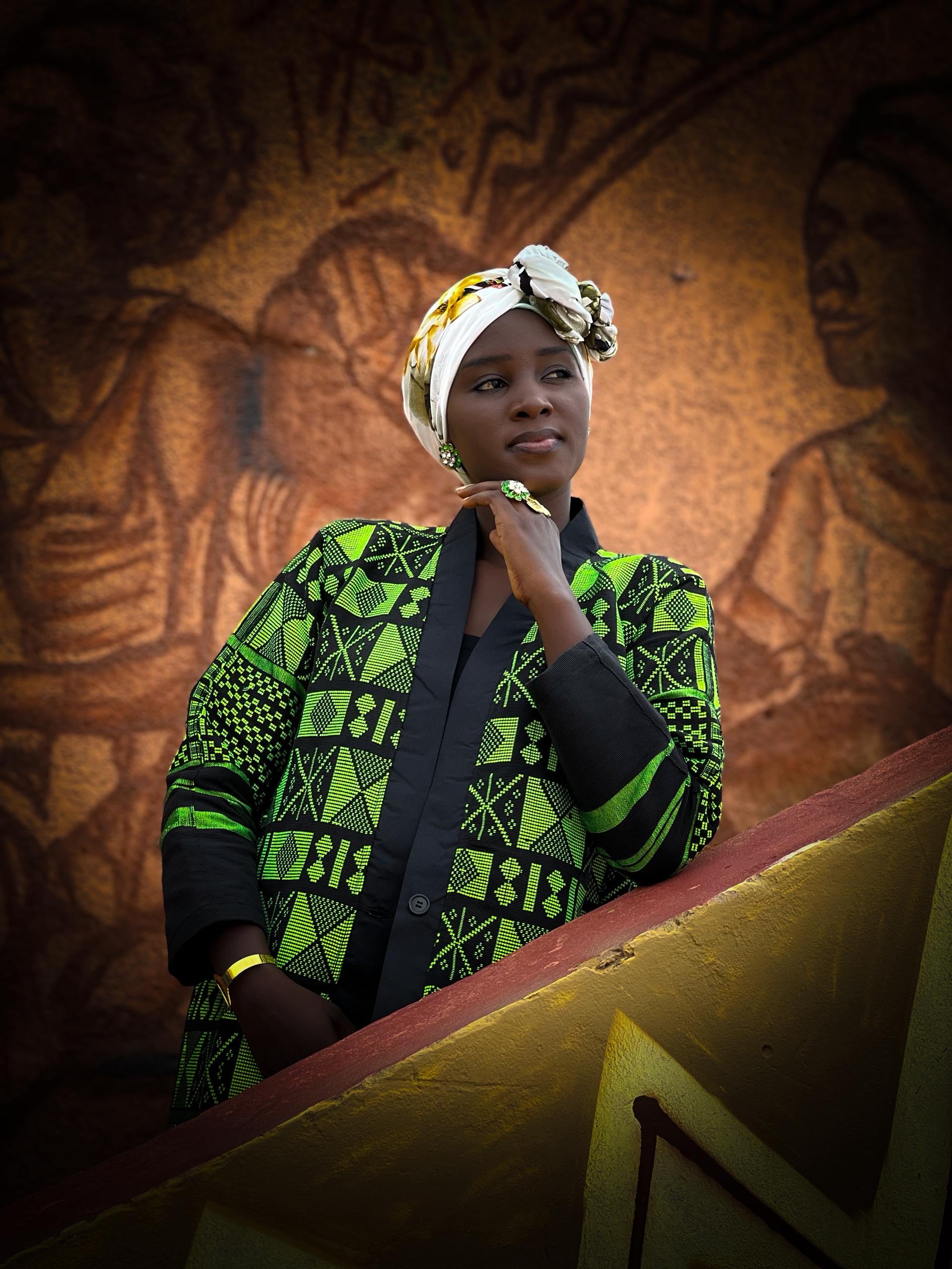 Kanoo Hand Woven Jacket showcased by a woman, highlighting authentic Senegalese heritage wear.